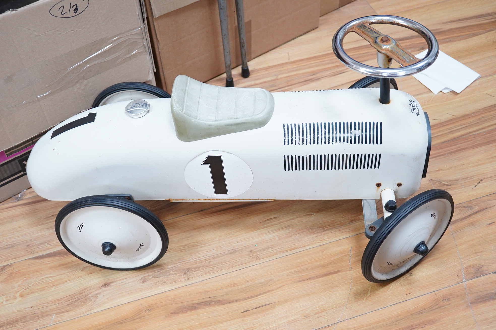 A mid 20th century Vilac child’s tinplate ride on car, body length 74cm